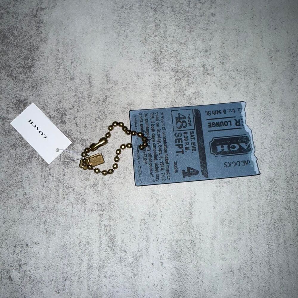 Coach blue leather keychain with ticket design